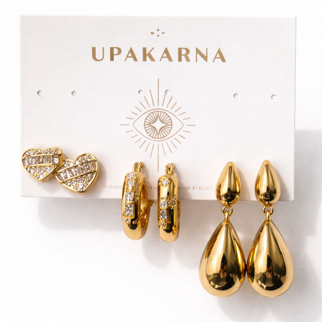 Stylish gold earrings with teardrop design, heart-shaped studs, and heart hoop earrings