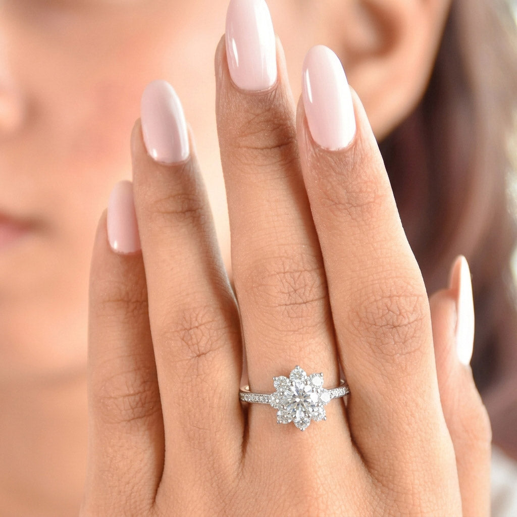 Imperial Blossom Ring with a round-cut center stone, floral diamond halo, and pavé band for regal, radiant elegance.