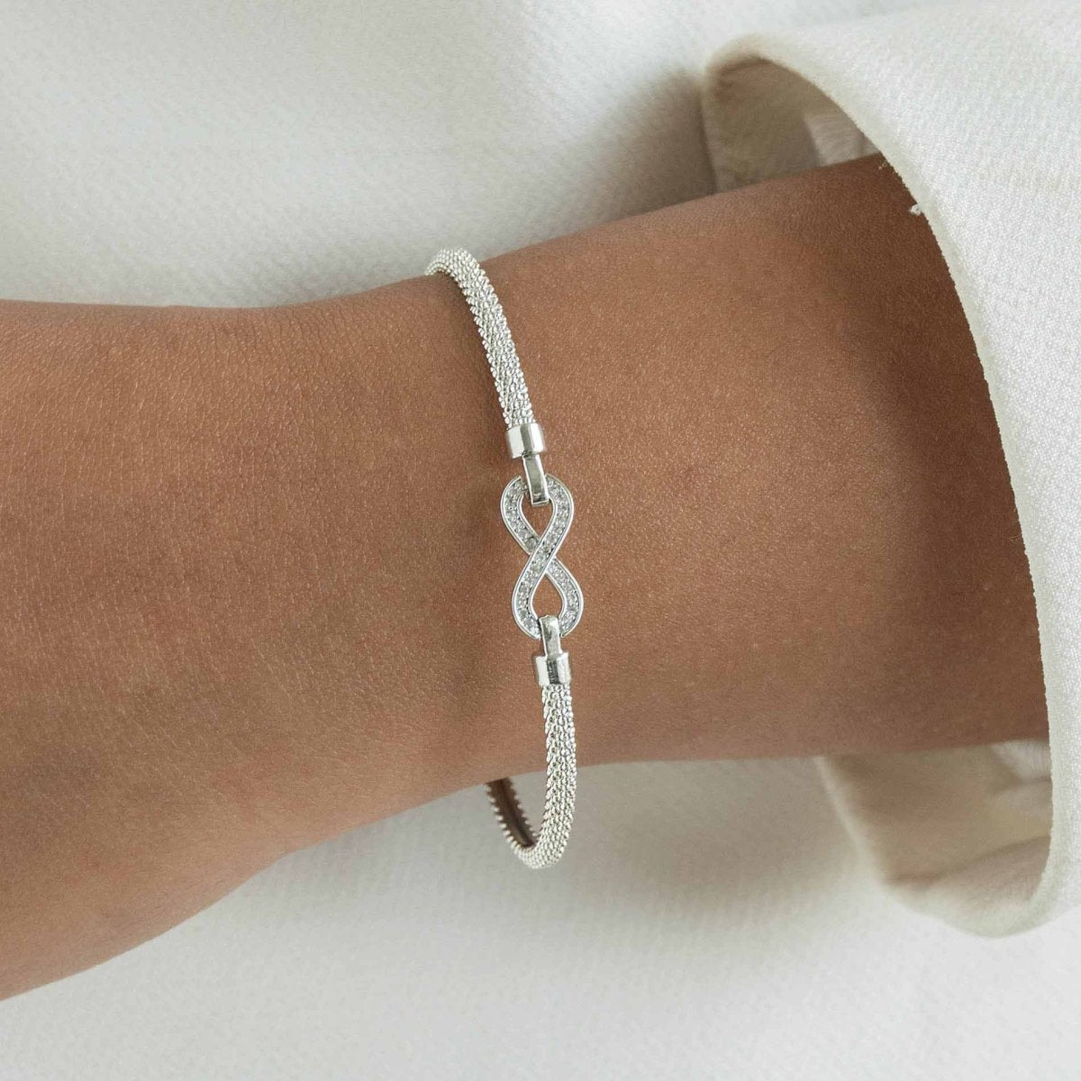 Infinity bangle with a sleek infinity motif and anti-tarnish finish, available in gold, rose gold, and silver, perfect for everyday wear, meaningful gifting, and timeless styling.
