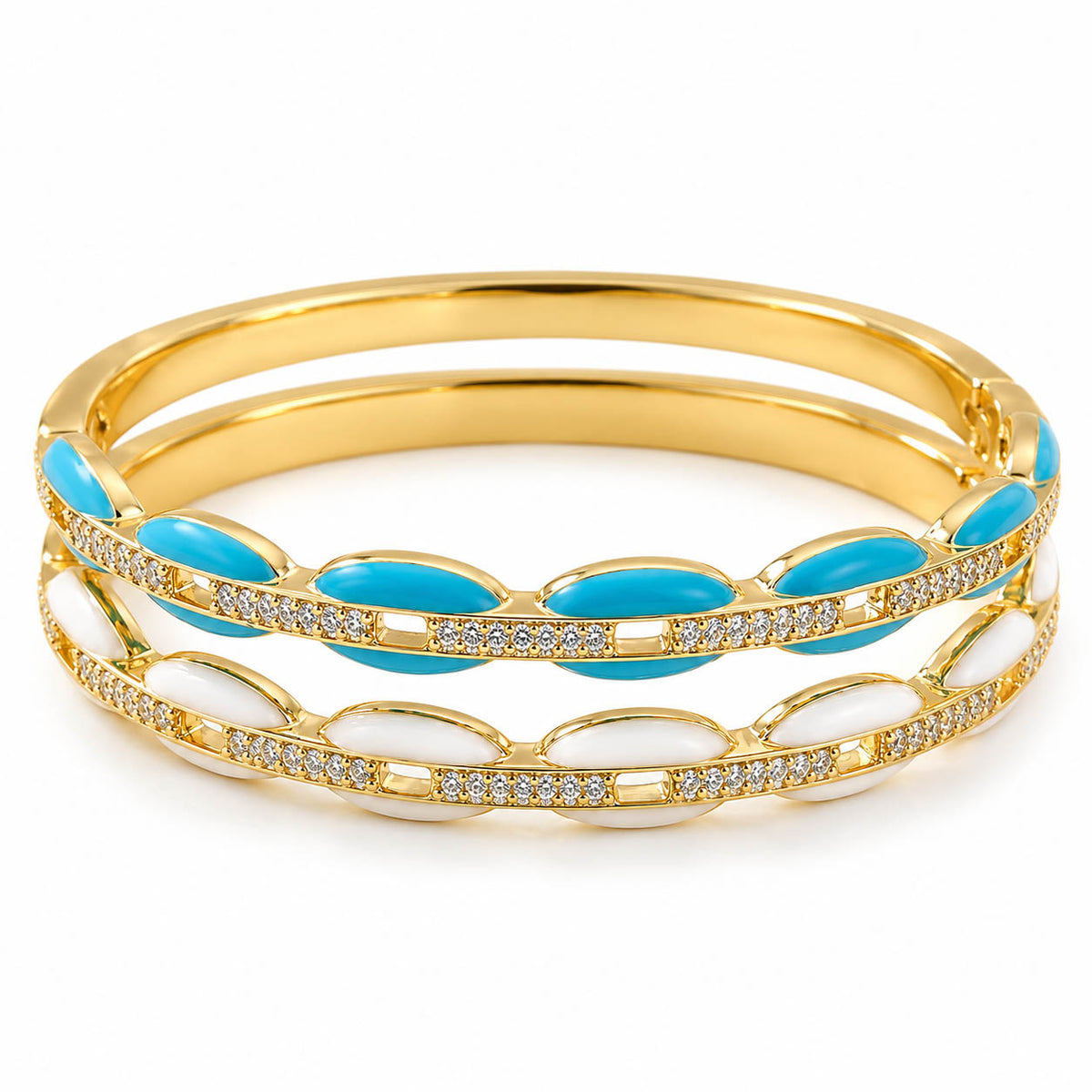 A product photo of a stacked set of gold-tone bangles featuring enamel stations in turquoise and white alongside rhinestone-paved accents.