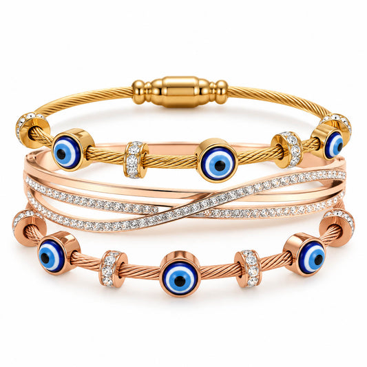 A set of three rose-gold-toned wire and cable-style bracelets displayed together as a coordinated stack.