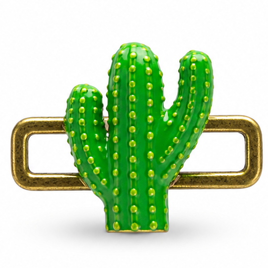 Detailed green cactus jewellery charm featuring a glossy three-arm saguaro cactus with raised yellow-green dot accents arranged in vertical rows, textured green ridges, and a rectangular antique-gold loop extending horizontally behind the cactus on both sides