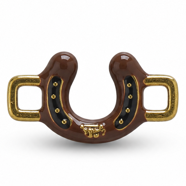 Detailed brown horseshoe jewellery charm featuring a glossy dark-brown U-shaped horseshoe with a black inner panel decorated with small gold studs, ornate gold detailing at the bottom center, and textured antique-gold rectangular loops extending from both sides