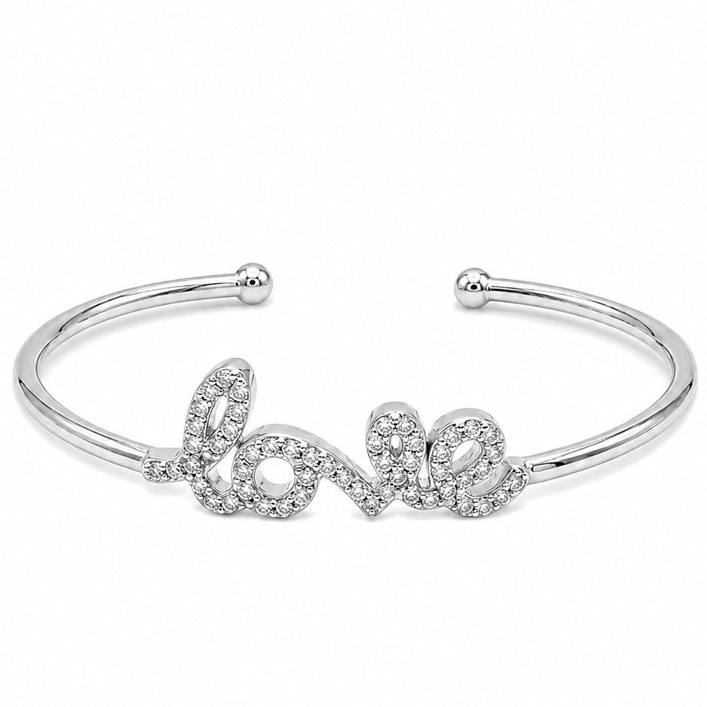 Anti-tarnish silver open cuff bracelet featuring a cursive "Love" script centerpiece fully encrusted with pavé-set clear cubic zirconia crystals, finished with ball-end terminals.