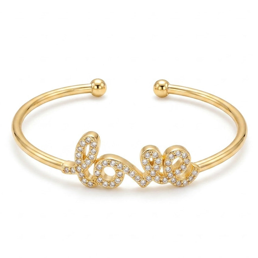 Anti-tarnish silver open cuff bracelet featuring a cursive "Love" script centerpiece fully encrusted with pavé-set clear cubic zirconia crystals, finished with ball-end terminals.