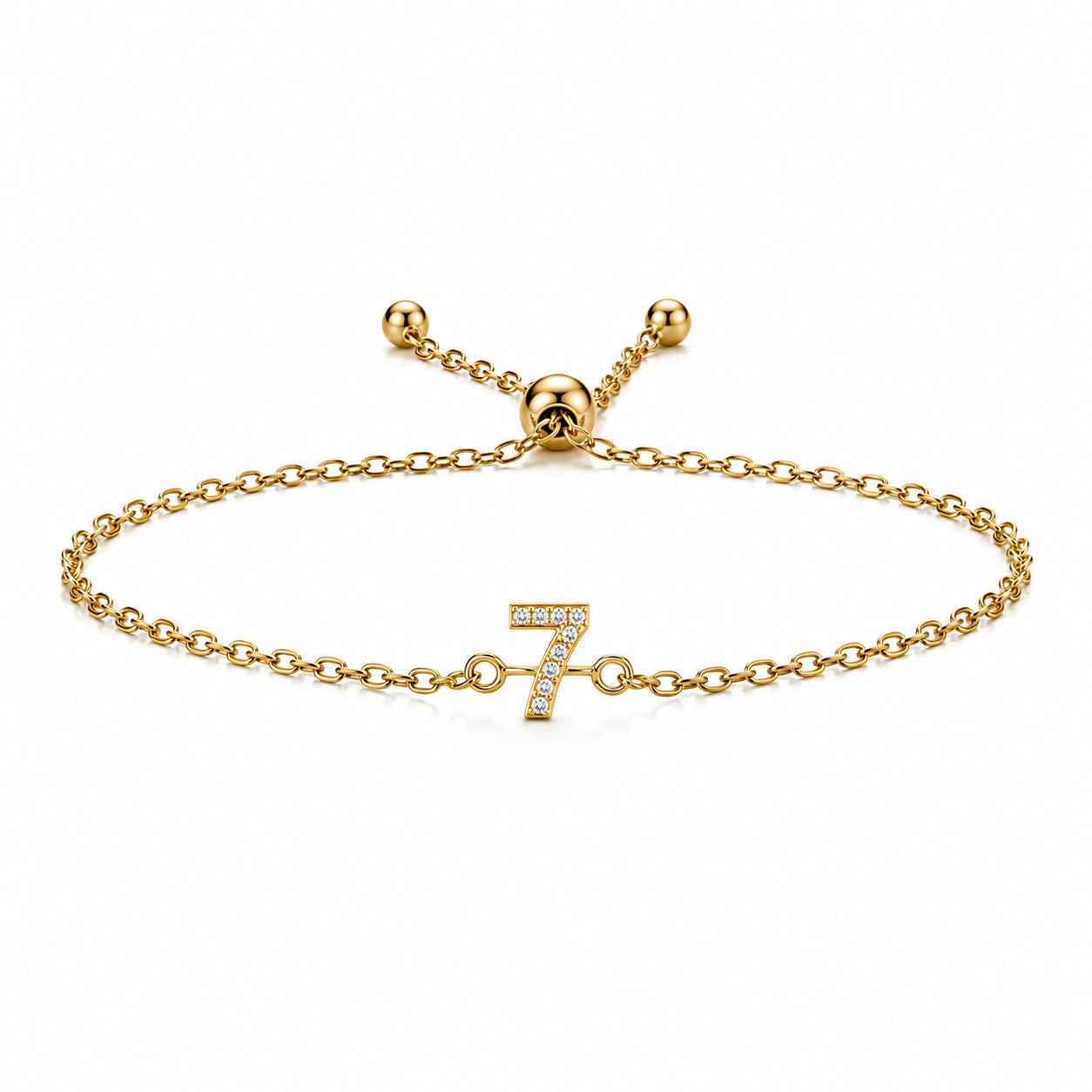 Gold chain lucky number 7 crystal bracelet with an adjustable slider clasp on a white background.