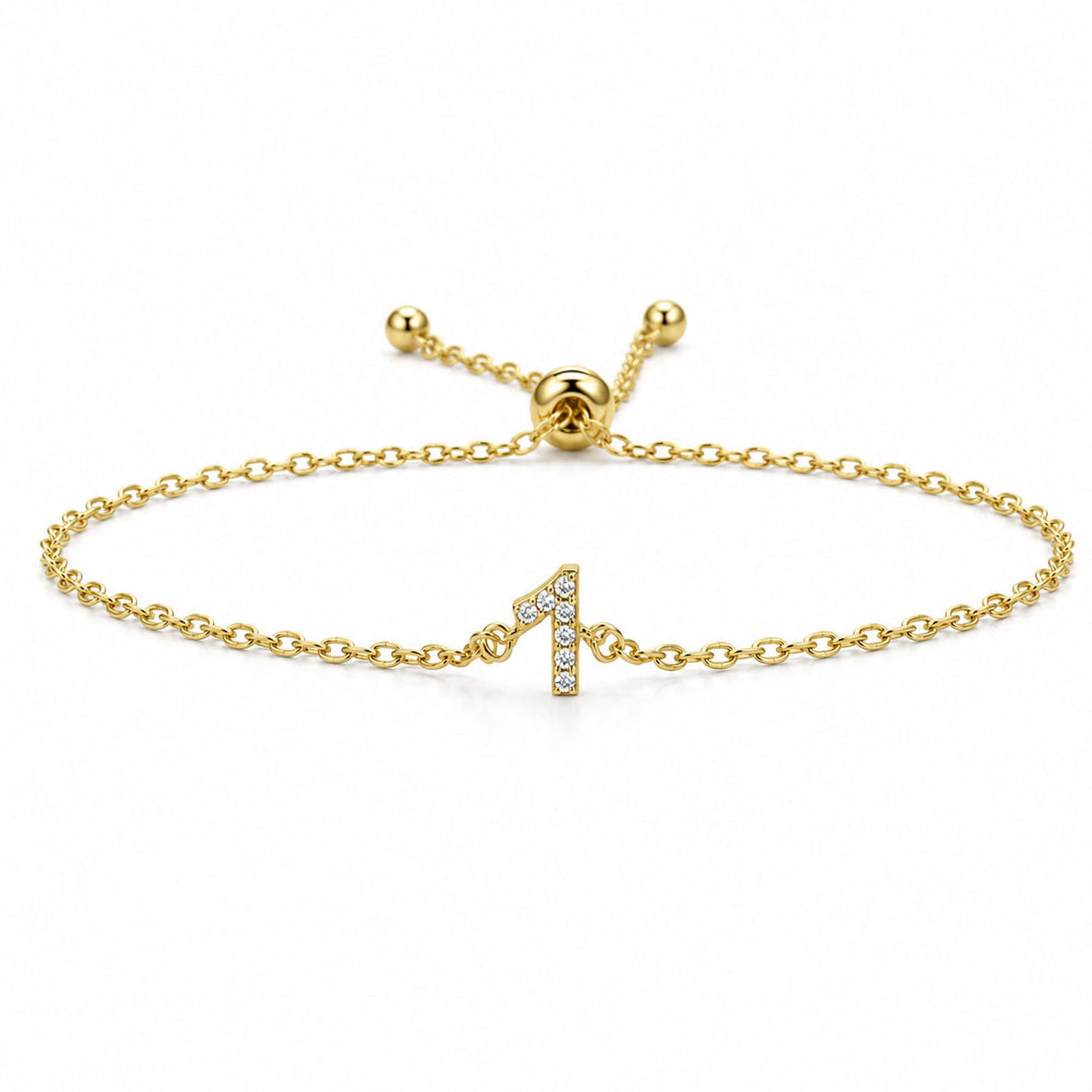 Gold chain lucky number 1 crystal bracelet with an adjustable slider clasp on a white background.