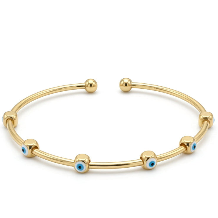 Anti-tarnish yellow gold open cuff bracelet featuring smooth, rounded gold bead stations with blue and white enamel evil eye motifs and spherical ball terminals, set against a solid white background.