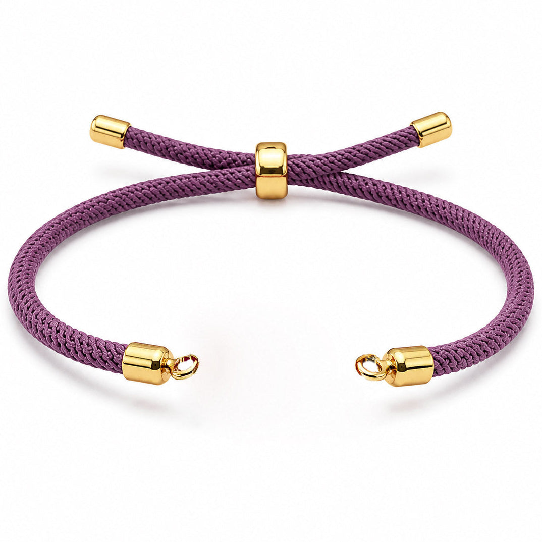 Purple braided cord bracelet with gold-tone end caps and an adjustable sliding clasp, displayed on a clean white background.