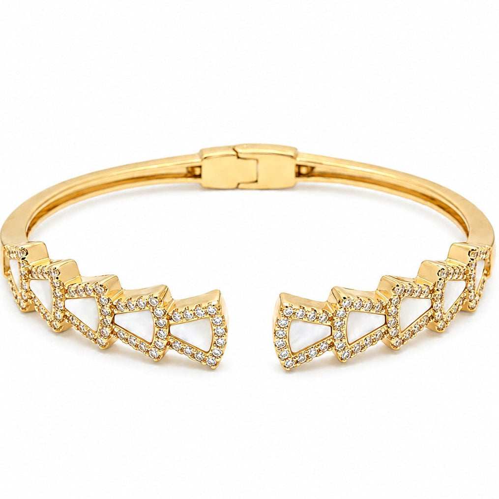 Anti-tarnish gold open-front cuff bracelet featuring repeating fan-shaped mother-of-pearl inlays framed by pavé cubic zirconia crystal halos and a secure rear hinge clasp.