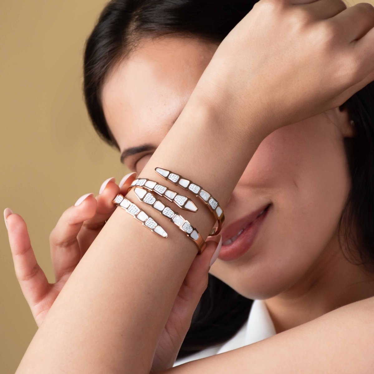 Elegant rosegold snake bracelet with mother-of-pearl detailing and an anti-tarnish finish, perfect for everyday elegance, gifting, and chic statement styling.