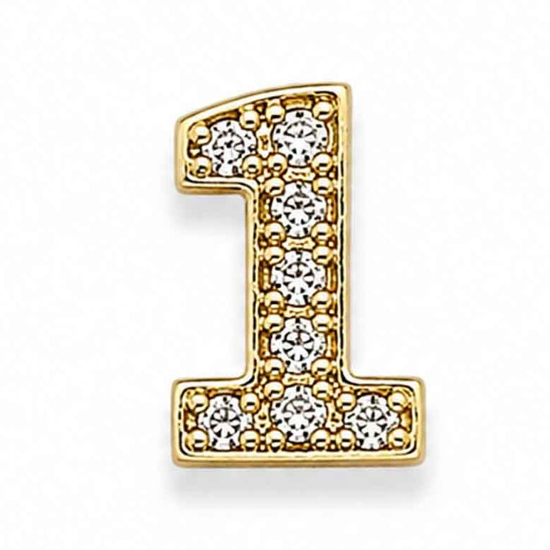 Zoomed-out view of a gold-toned letter “1” charm decorated with sparkling white floral stones, placed on a clean white background.