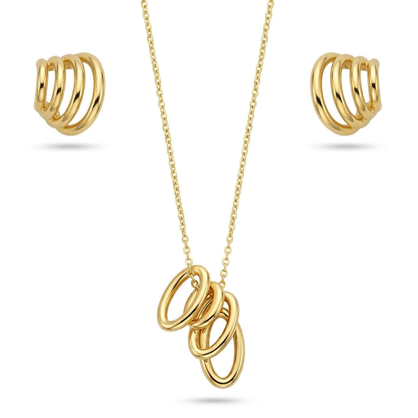 A polished yellow gold jewelry set isolated on a plain white background, featuring a fine-chain necklace hung with a cluster pendant of four interlocked, smooth oval rings. The set is accompanied by matching huggie-style hoop earrings designed with four fused parallel curved bands, creating a chic, sculptural aesthetic.