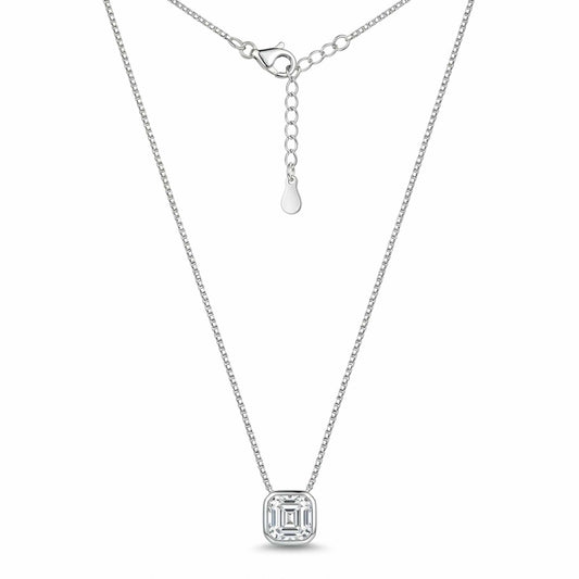 Silver geometric solitaire pendant necklace featuring a square-cut crystal in a bezel setting on a delicate chain, displayed on a white background.