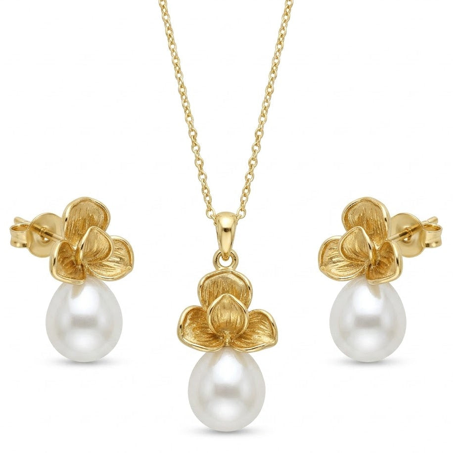 Gold floral pearl drop necklace set with matching stud earrings.
Elegant design on a clean white background.