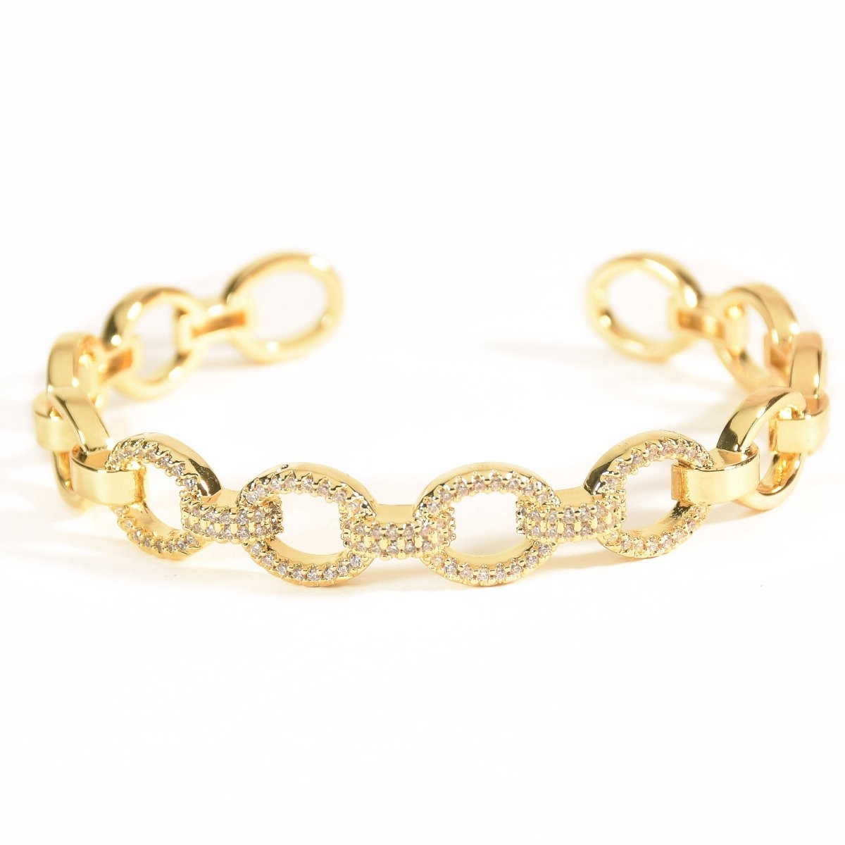Elegant golden oval link cuff bangle with sparkling stone detailing and an adjustable anti-tarnish finish, perfect for everyday elegance, parties, and chic stacked styling.
