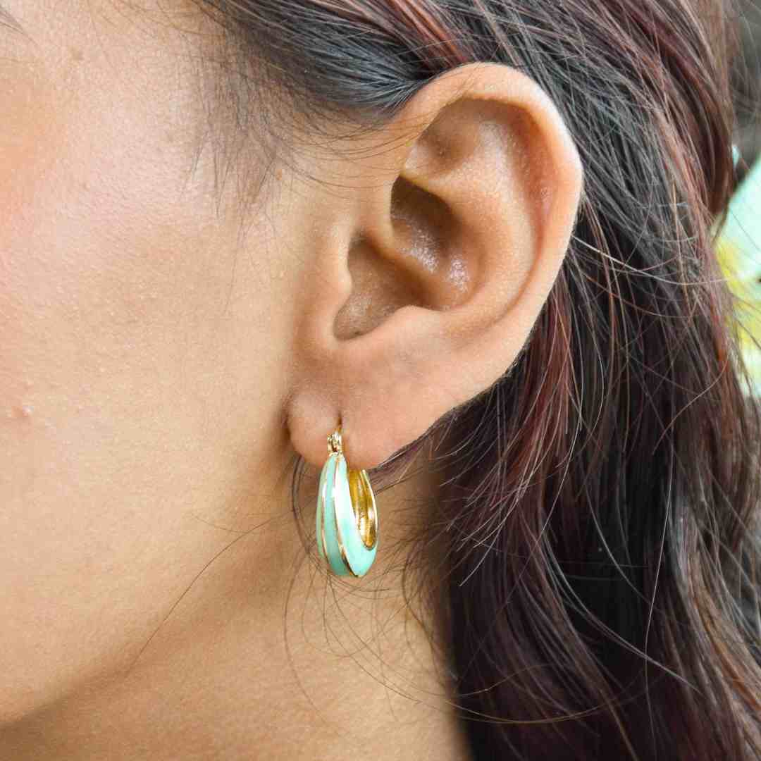 Pastel enamel hoops with colorful enamel detailing and an anti-tarnish gold finish, perfect for everyday wear and playful styling.
