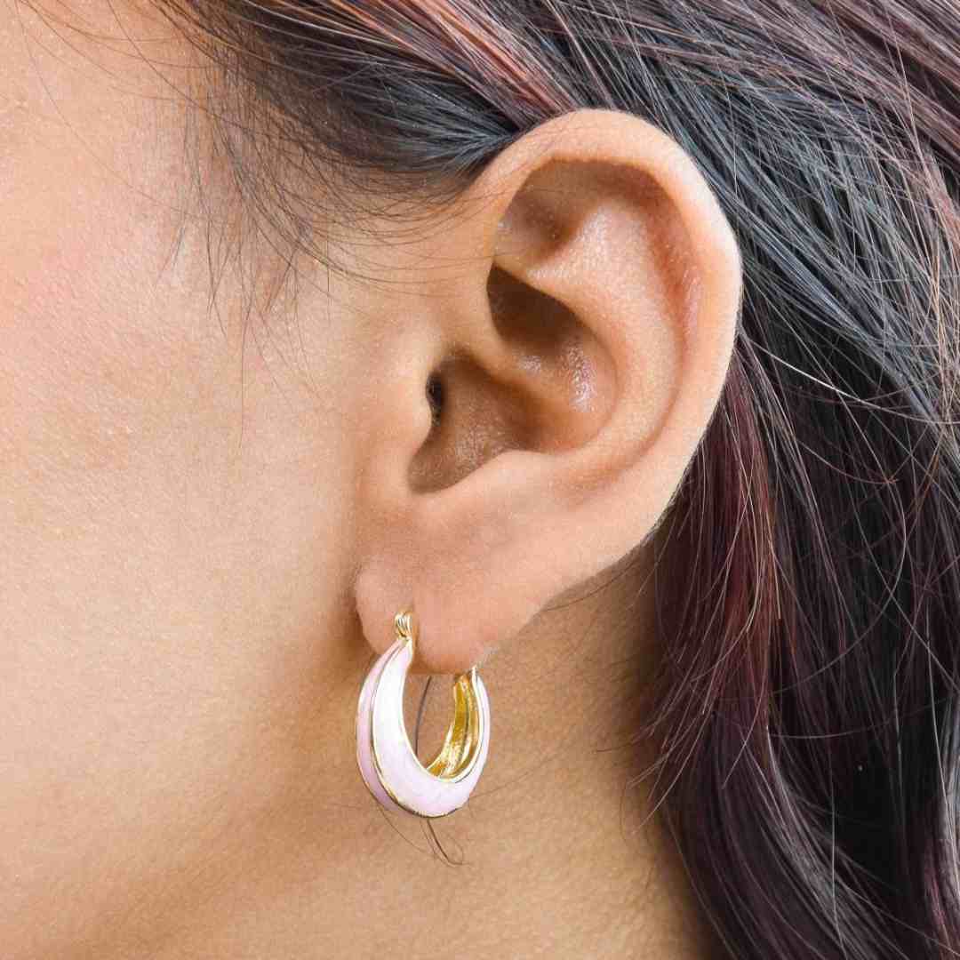 Pastel enamel hoops with colorful enamel detailing and an anti-tarnish gold finish, perfect for everyday wear and playful styling.
