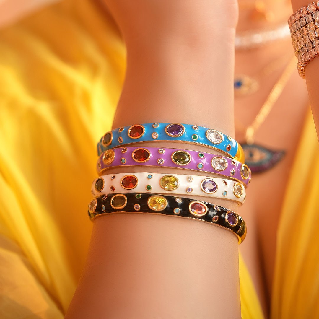 Elegant rainbow cuff bangles in soft pastel shades with an adjustable anti-tarnish finish, perfect for everyday wear, playful styling, and adding a colorful touch to any look.

