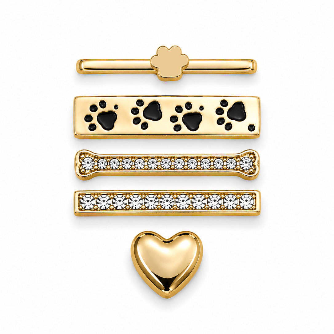 Gold-tone watch accessory set featuring a paw clip, paw-print clip, crystal-studded clips, and a heart-shaped clip on a white background.
