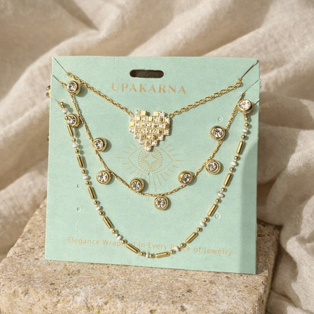 Pixel Heart Necklace Stack with Mosaic Heart, Diamond Dust, and Modern Morse layered gold-tone necklaces