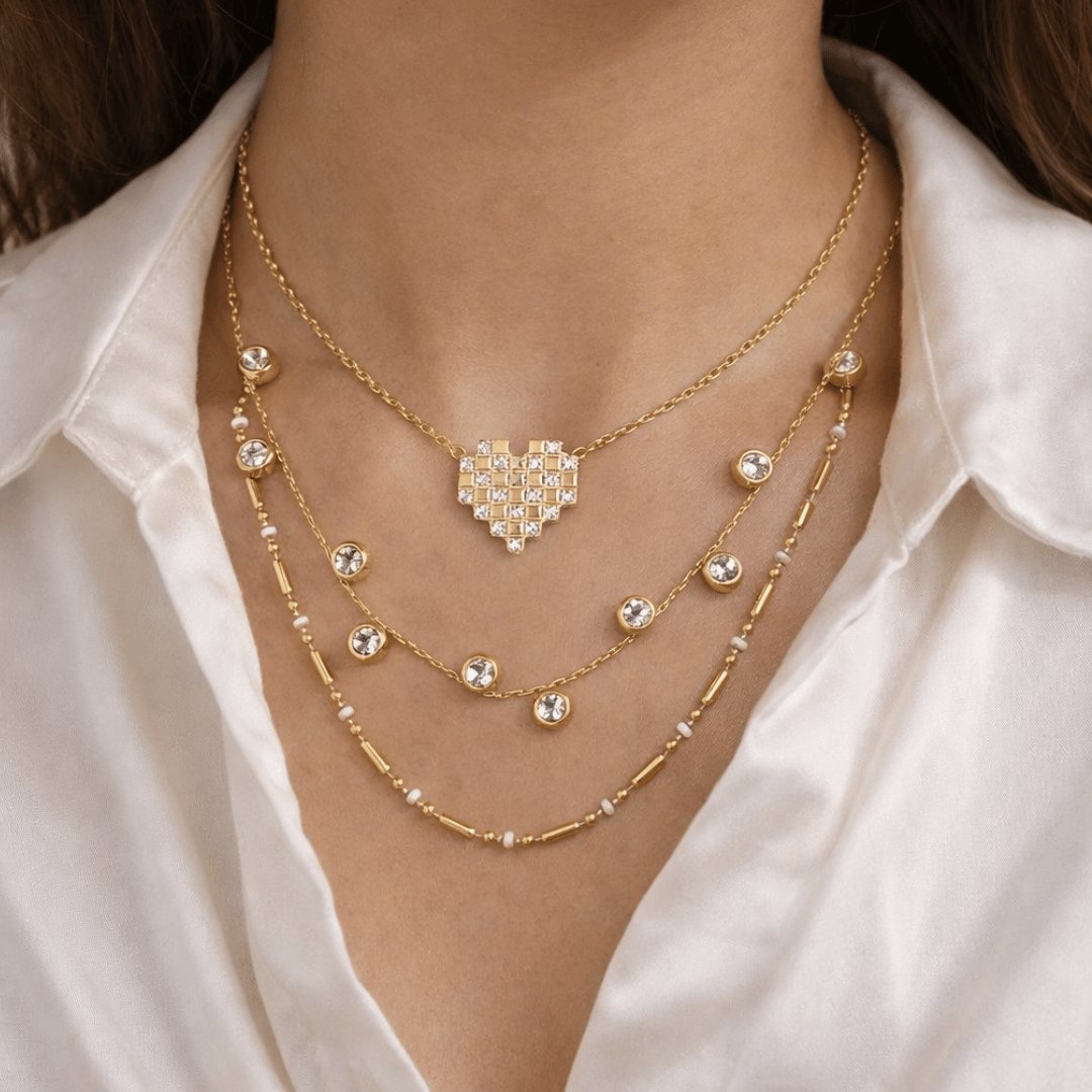 Pixel Heart Necklace Stack with Mosaic Heart, Diamond Dust, and Modern Morse layered gold-tone necklaces