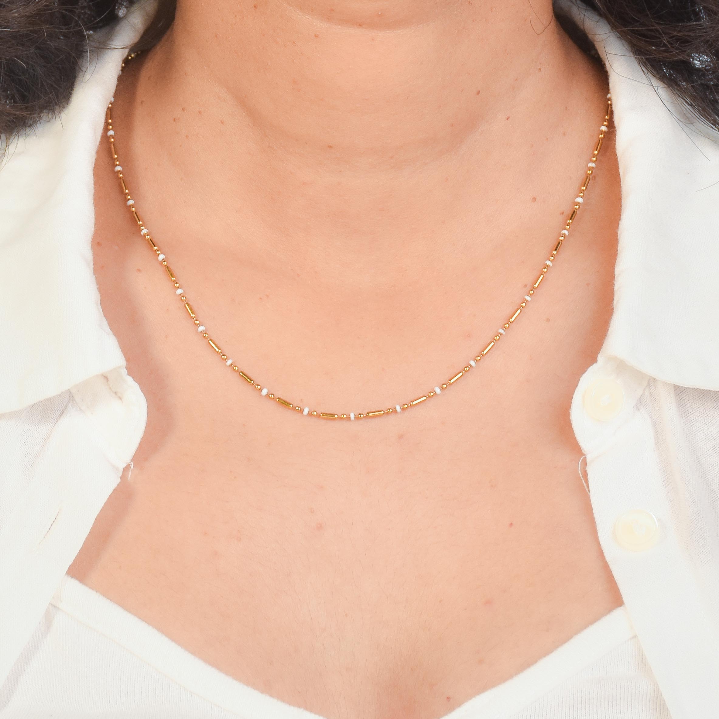 Pixel Heart Necklace Stack with Mosaic Heart, Diamond Dust, and Modern Morse layered gold-tone necklaces