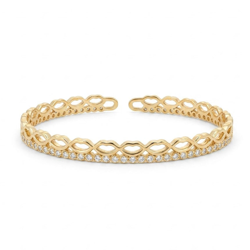 Elegant gold-tone adjustable open cuff bangle featuring an intricate infinity-inspired openwork design with a row of sparkling pavé crystals along the front. The lightweight anti-tarnish bangle has a polished finish and is displayed on a clean white background, making it perfect for everyday wear, stacking, gifting, and special occasions.