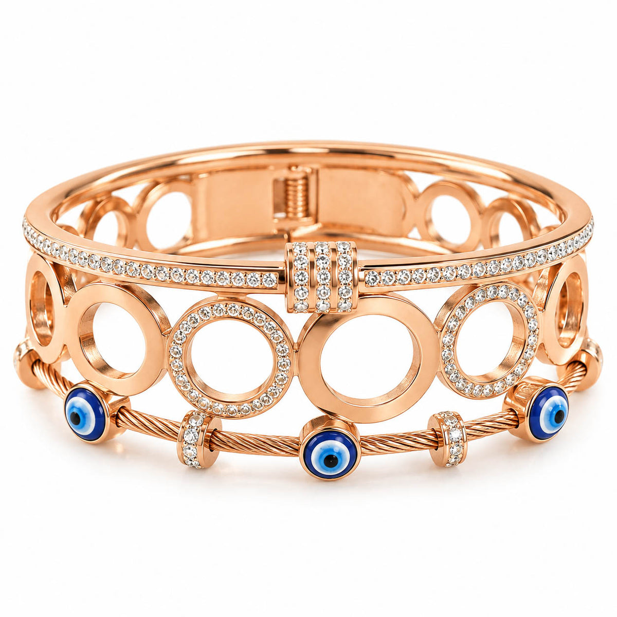 A studio shot of a curated stack of luxury rose gold bracelets, showcasing an openwork circular link pattern, a shimmering rhinestone-paved band, and a twisted cable bracelet accented with enamel evil eye beads.