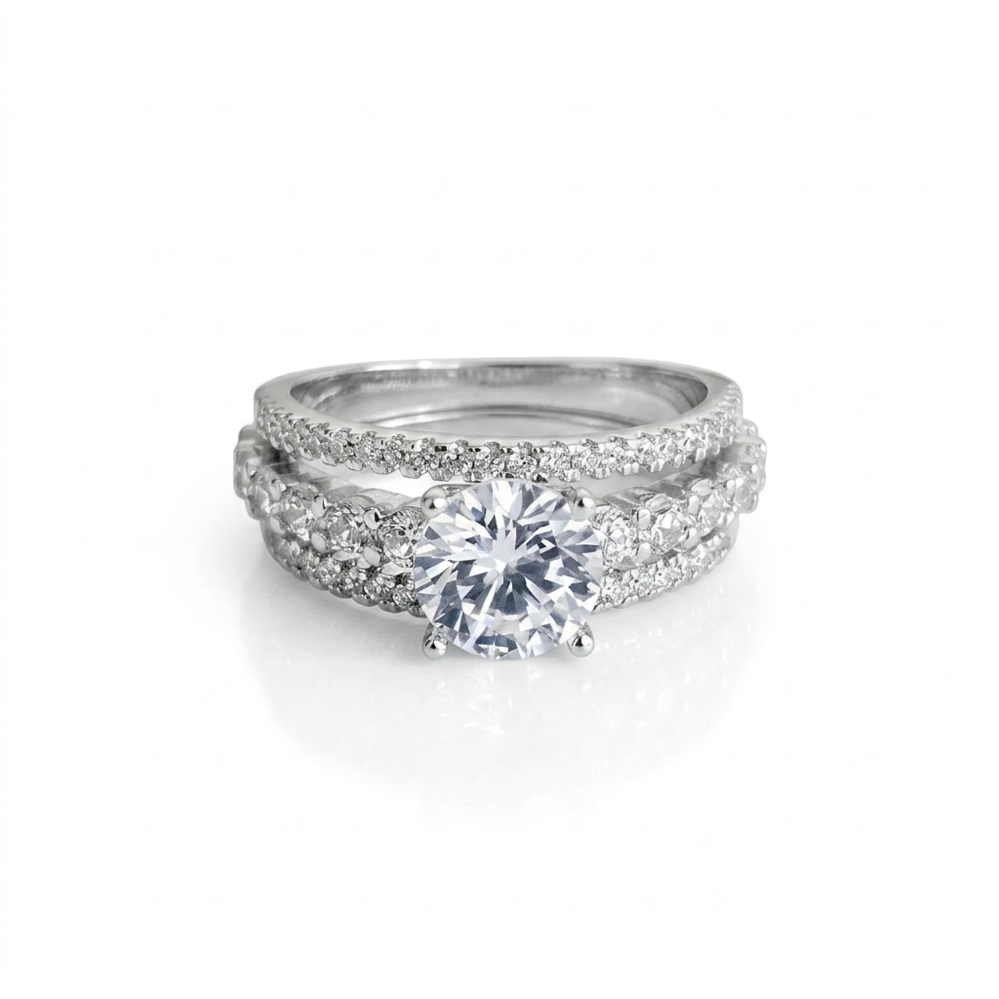 Royal Diamond 925 Sterling Silver Ring with a round brilliant-cut center stone and sparkling pave-set diamond crossover bands in polished sterling silver