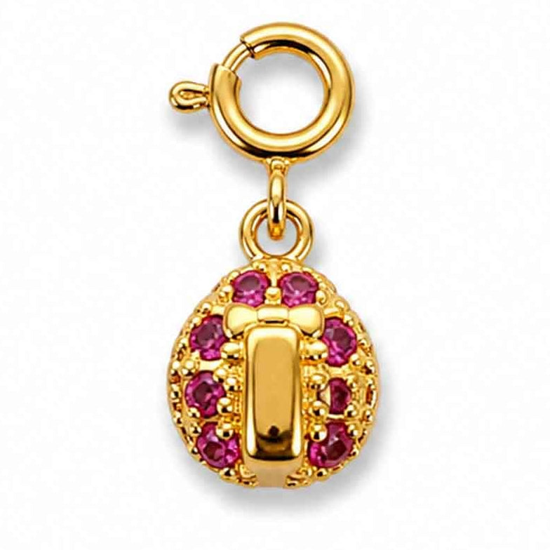 Zoomed-out view of a gold-tone beetle-shaped charm with pink and clear sparkling stone accents, displayed on a clean white background.