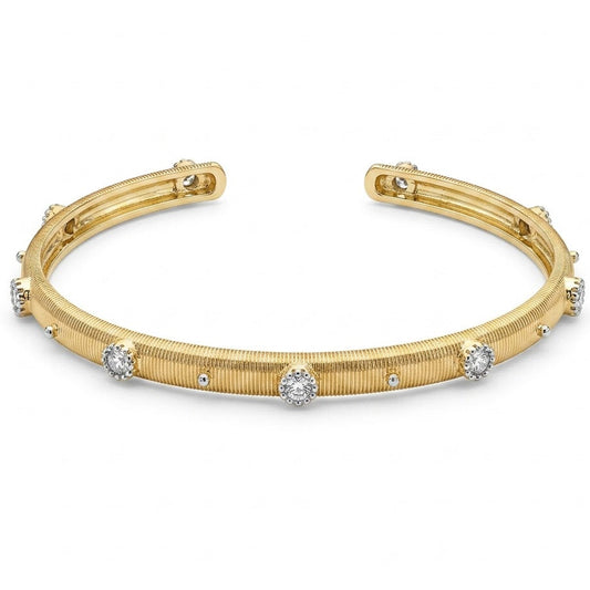 Anti-tarnish yellow gold open cuff bracelet featuring a fine vertically ribbed texture, studded with round clear cubic zirconia halo stations and silver bead accents along the band. on a white background .