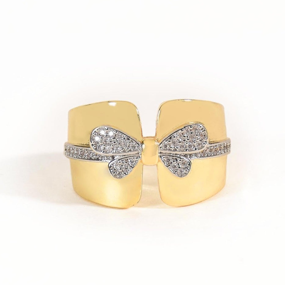Elegant golden bow ring with sparkling pavé detailing and an anti-tarnish finish. perfect for playful glamour, special occasions, and chic everyday styling.