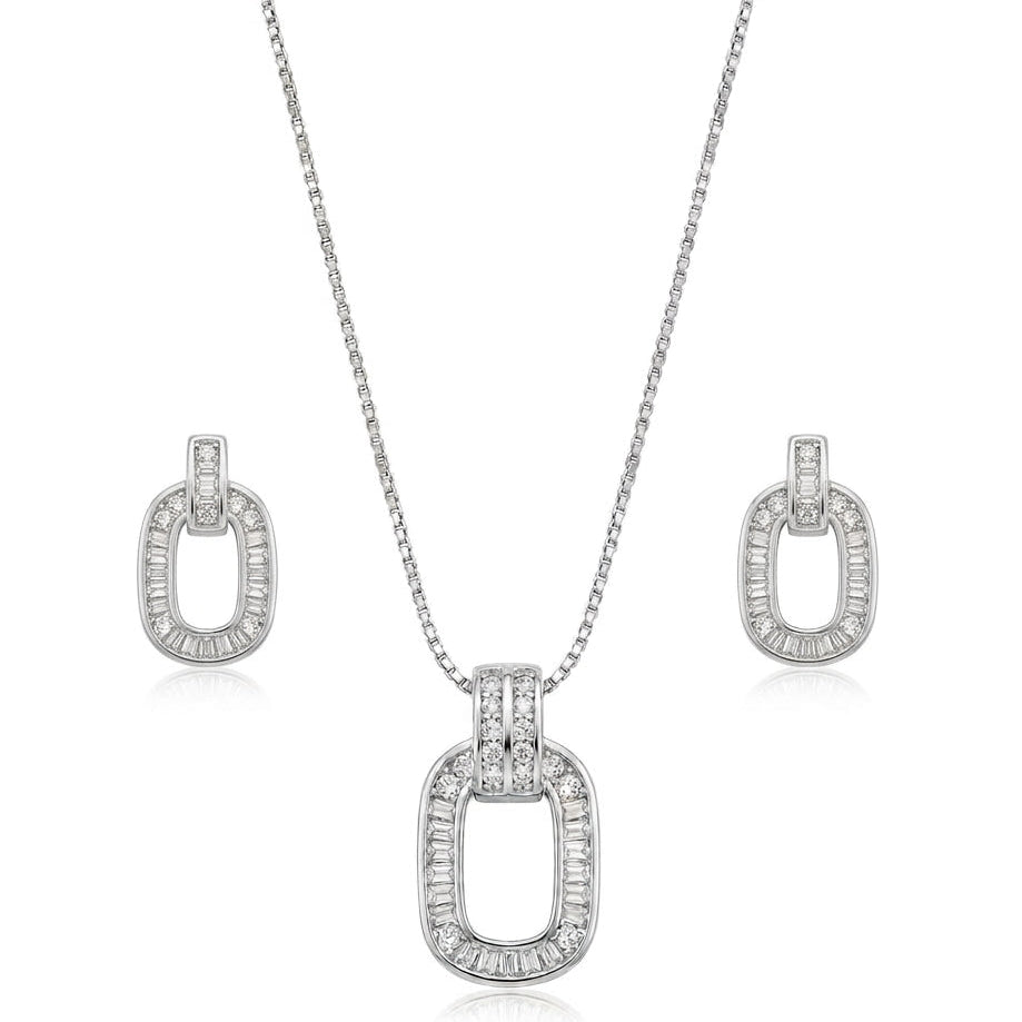 A silver jewelry set isolated on a plain white background, featuring a box-chain pendant necklace and matching drop earrings. The design showcases an open oval motif bordered with channel-set baguette cubic zirconia stones, suspended from a double-row pavé-set bail for a sophisticated, modern look.