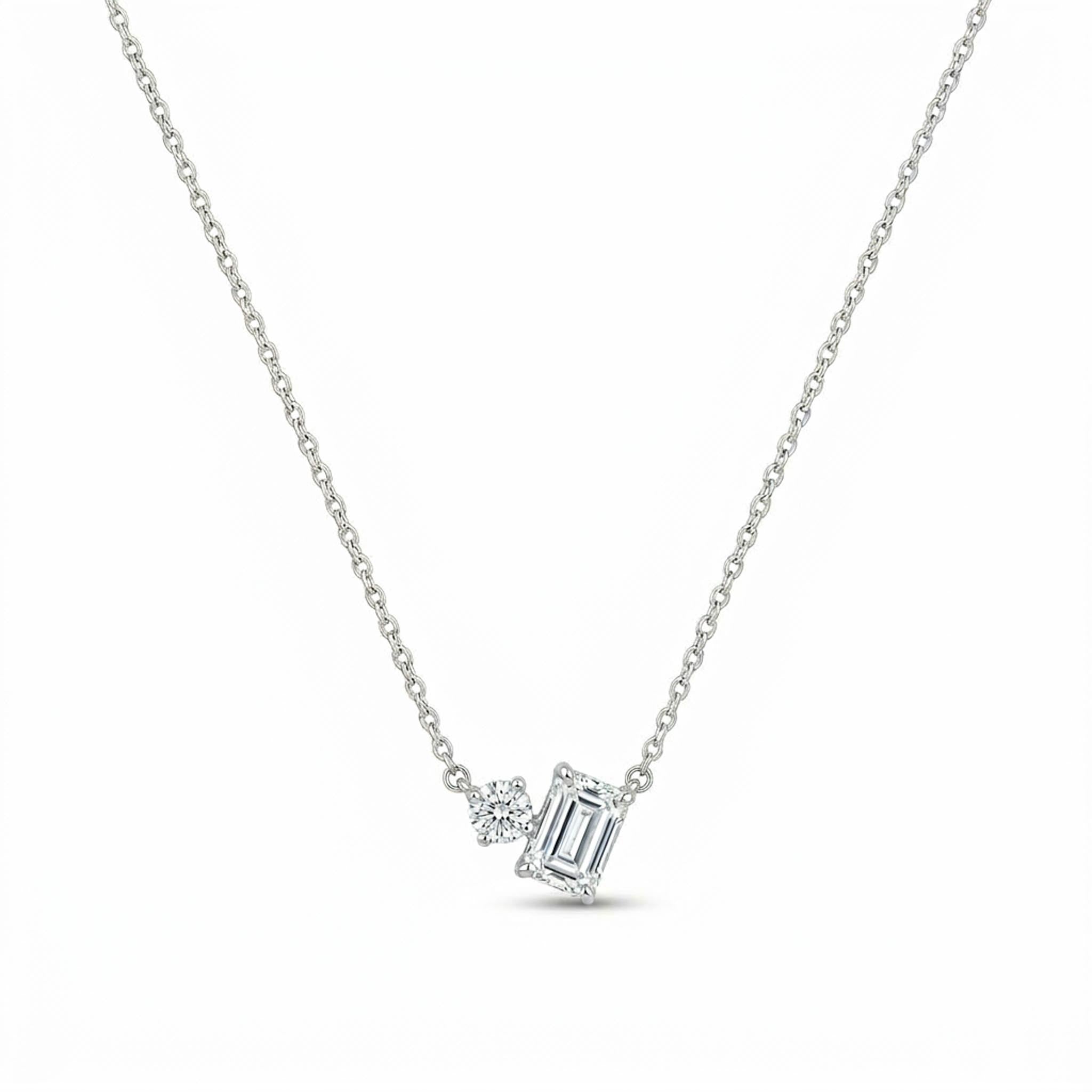 Solitaire Duo 925 sterling silver necklace featuring an emerald-cut crystal and round brilliant-cut crystal pendant on a delicate silver chain