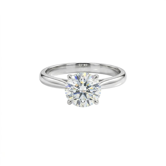 Silver solitaire ring featuring a round-cut crystal in a classic six-prong setting, displayed on a white background