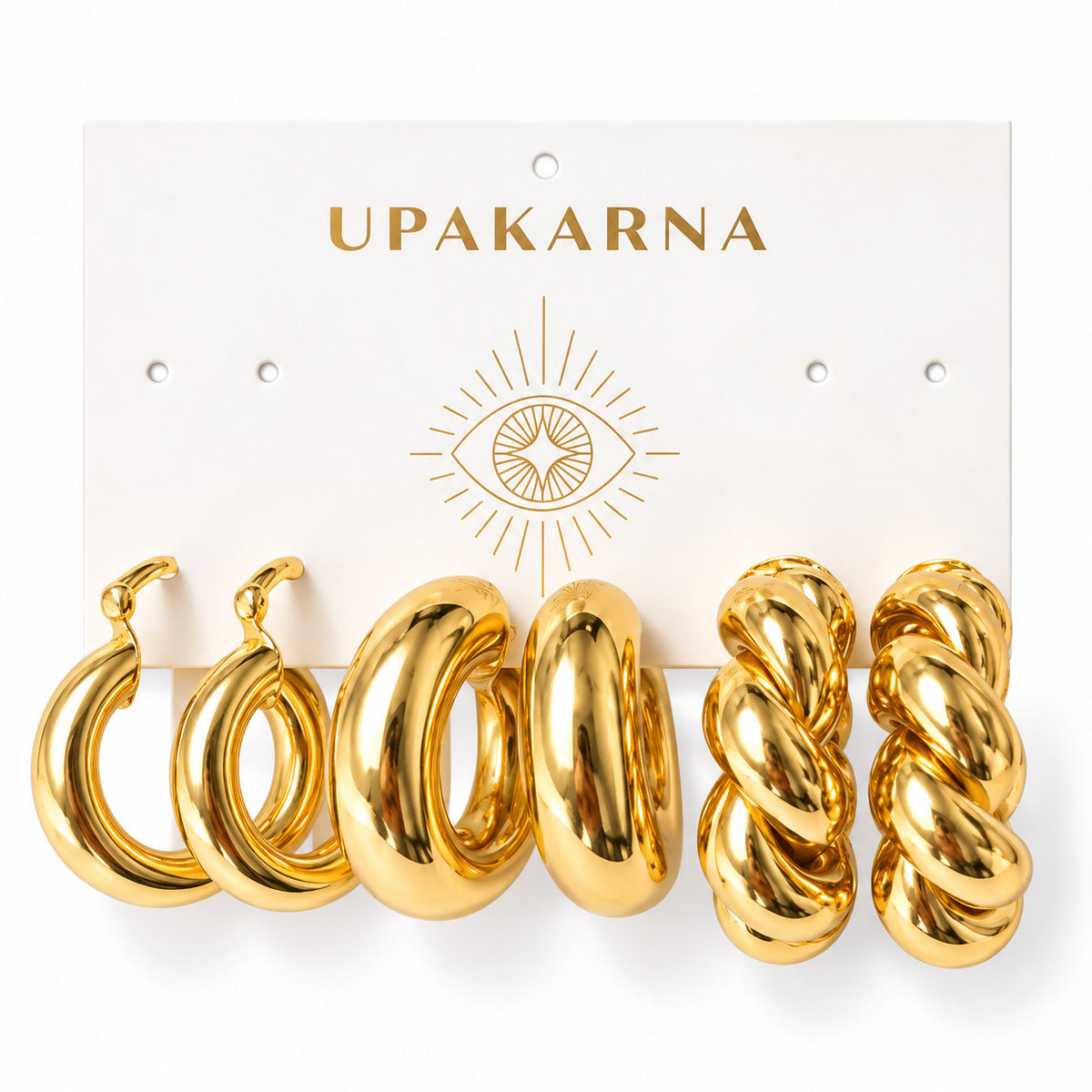 Upakarna earring display card featuring three pairs of gold earrings: chunky double hoops, oversized puff hoops, and twisted statement hoops on a clean white background.