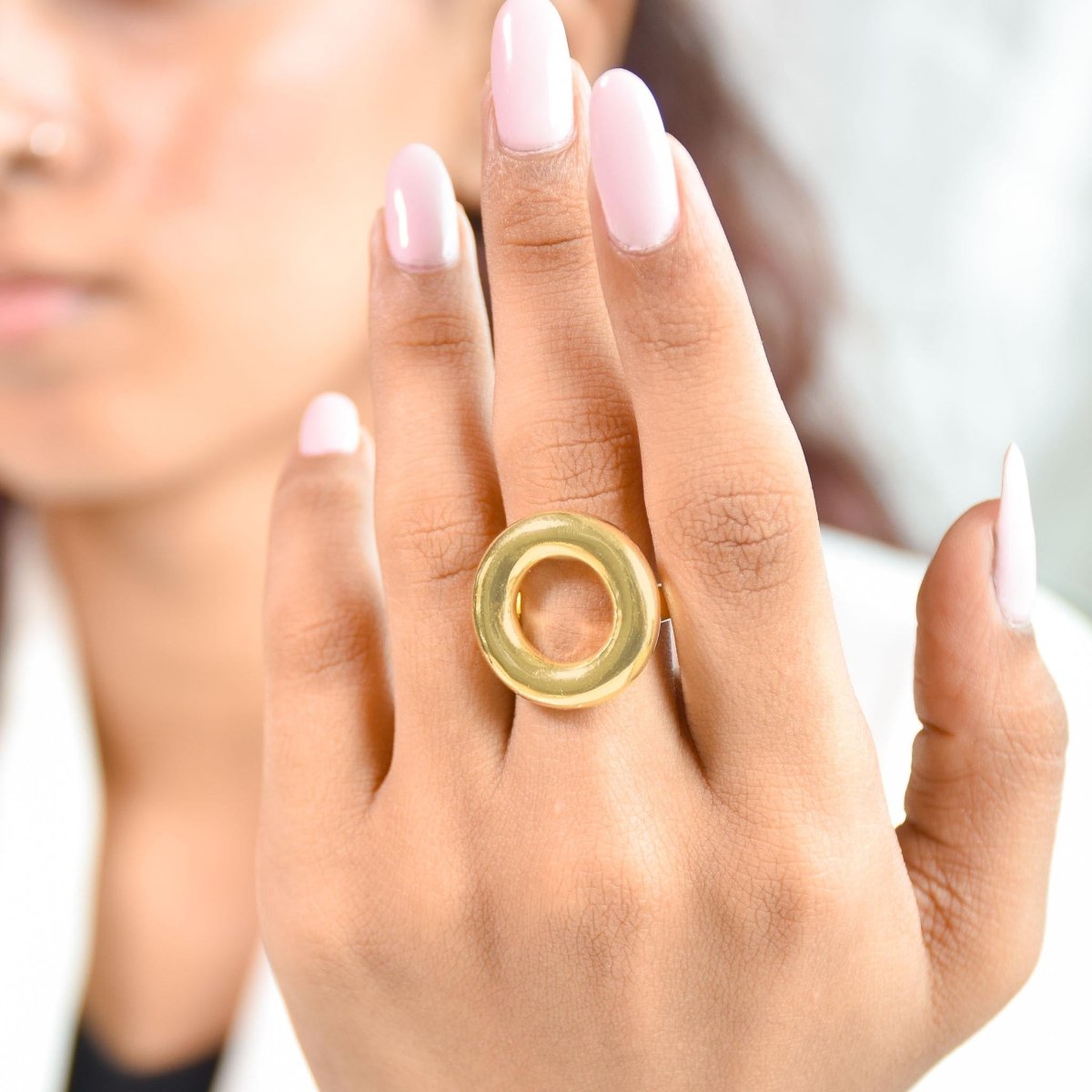 Bold golden statement ring with a sleek open-oval design and anti-tarnish finish. perfect for modern styling, minimalist looks, and effortless day-to-night elegance.
