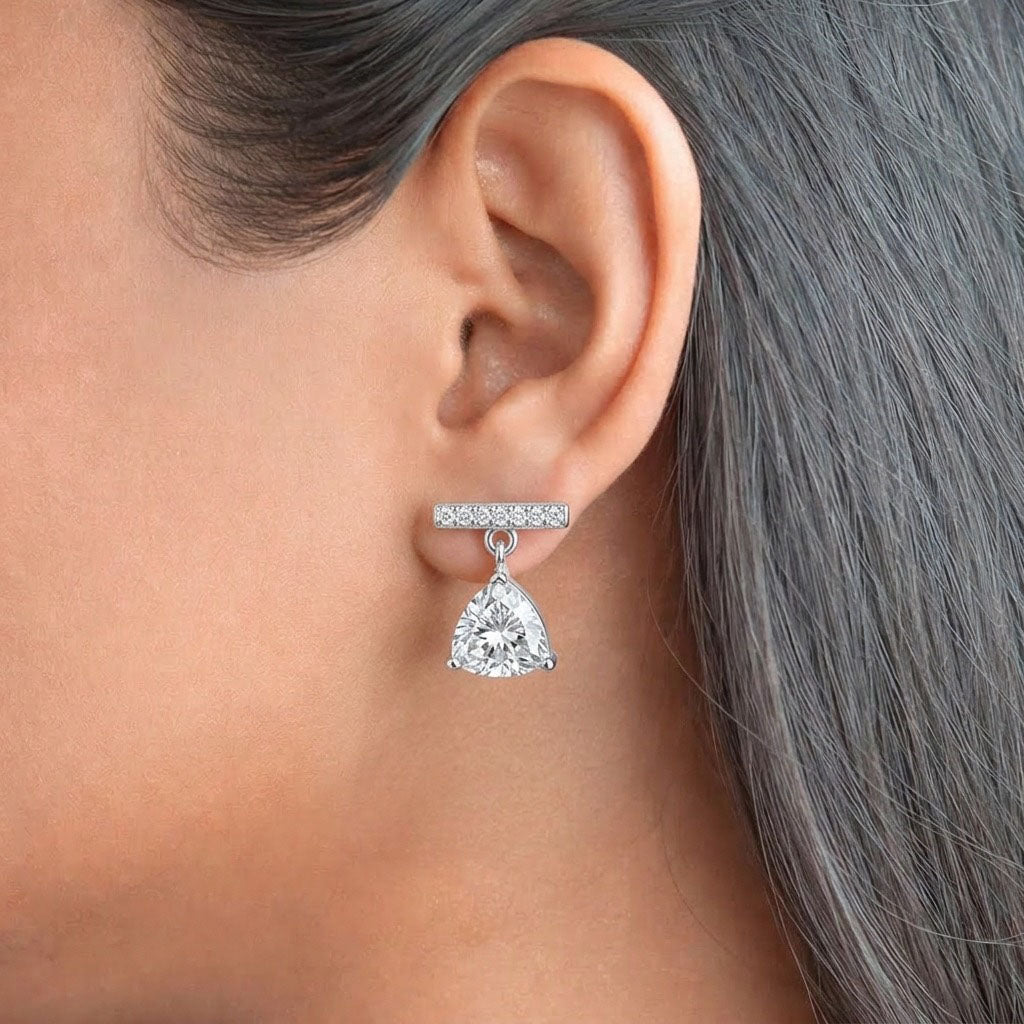 Stellar Drop 925 Sterling Silver Earrings featuring dazzling trillion-cut cubic zirconia drops suspended from pave -set bar studs