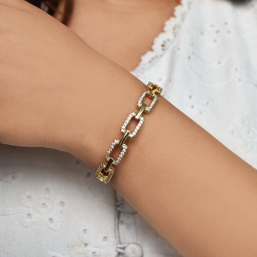 Studded buckle link chain bangle with sparkling stone detailing and an anti-tarnish finish, perfect for everyday wear, modern styling, and thoughtful gifting.

