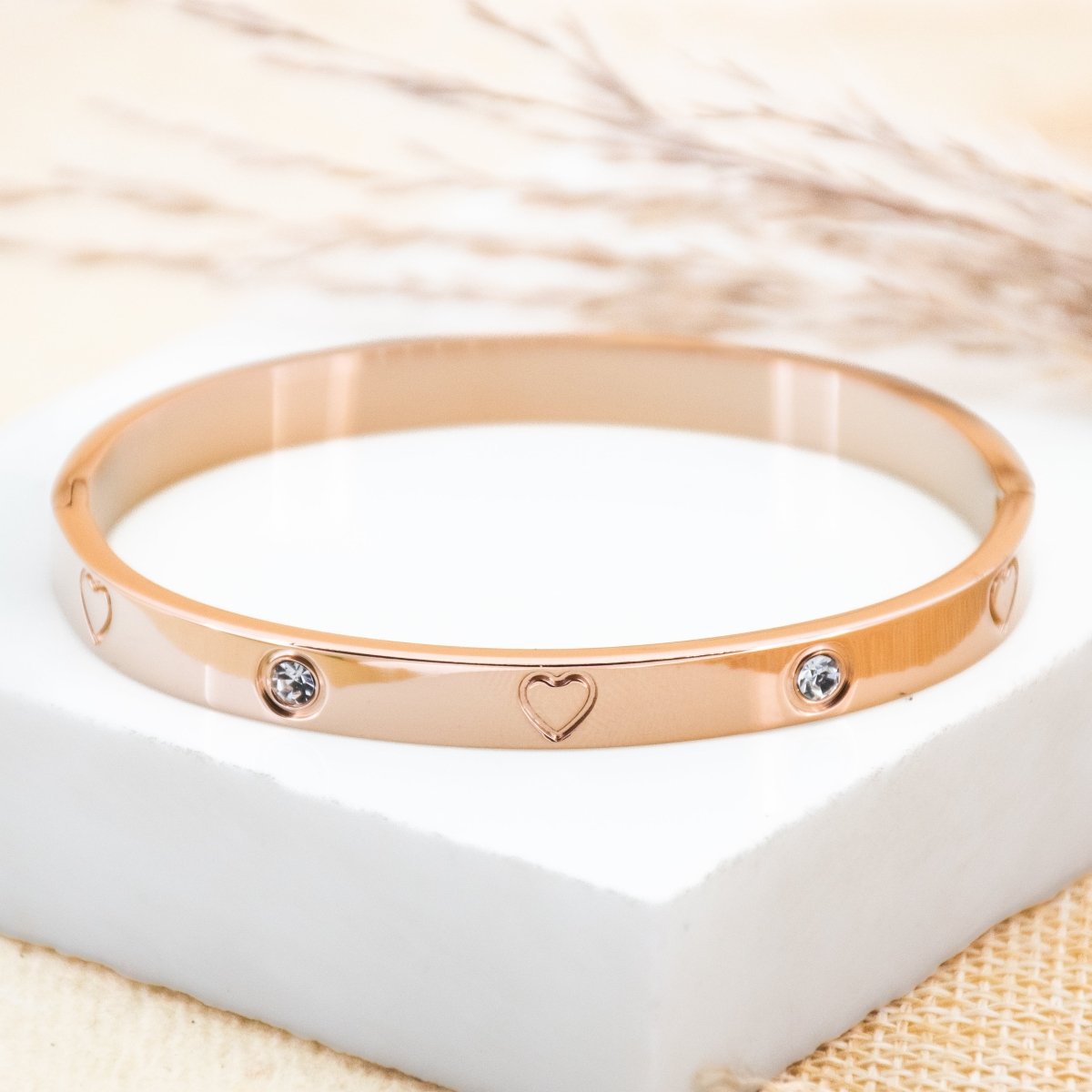 Elegant heart-studded bangles with sparkling detailing and an anti-tarnish finish, available in golden, rosegold, and silver, perfect for everyday wear, gifting, and chic stacked styling.
