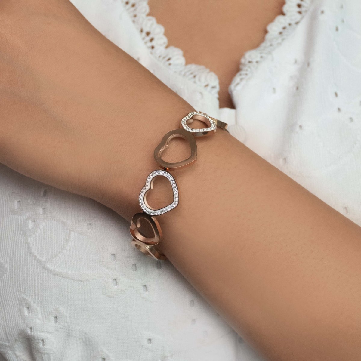 Elegant rosegold heart bangle with sparkling studded detailing and an anti-tarnish finish, perfect for everyday wear, gifting, and romantic chic styling.
