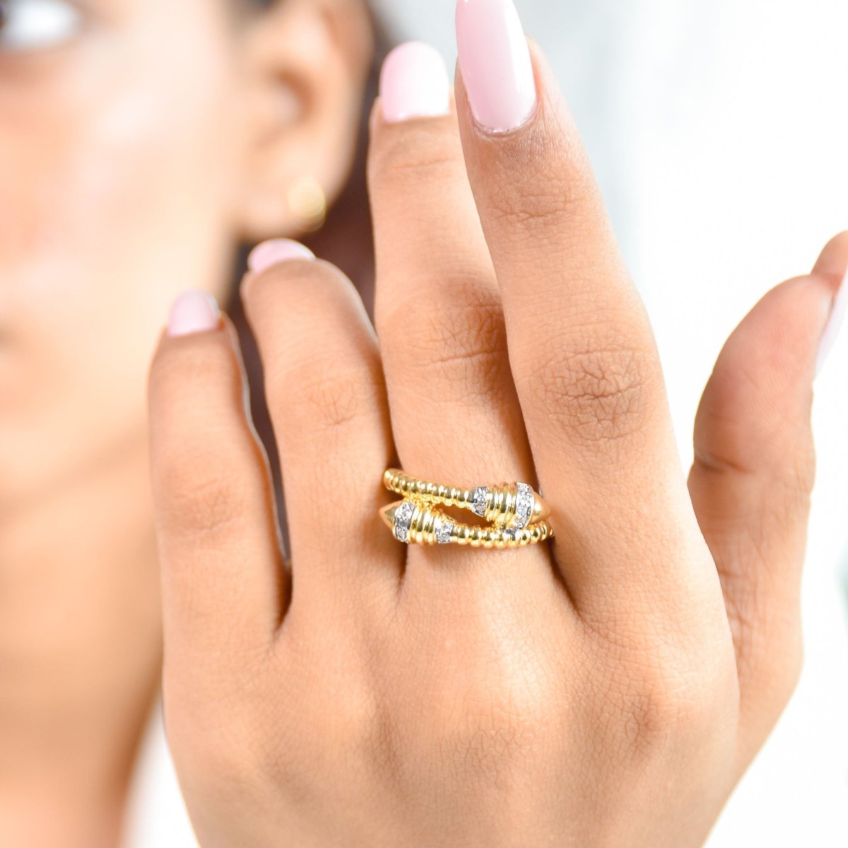 Luxurious golden multi-band ring with sparkling clover and butterfly motifs in an anti-tarnish finish. perfect for statement styling, elegant occasions, and everyday glamour.
