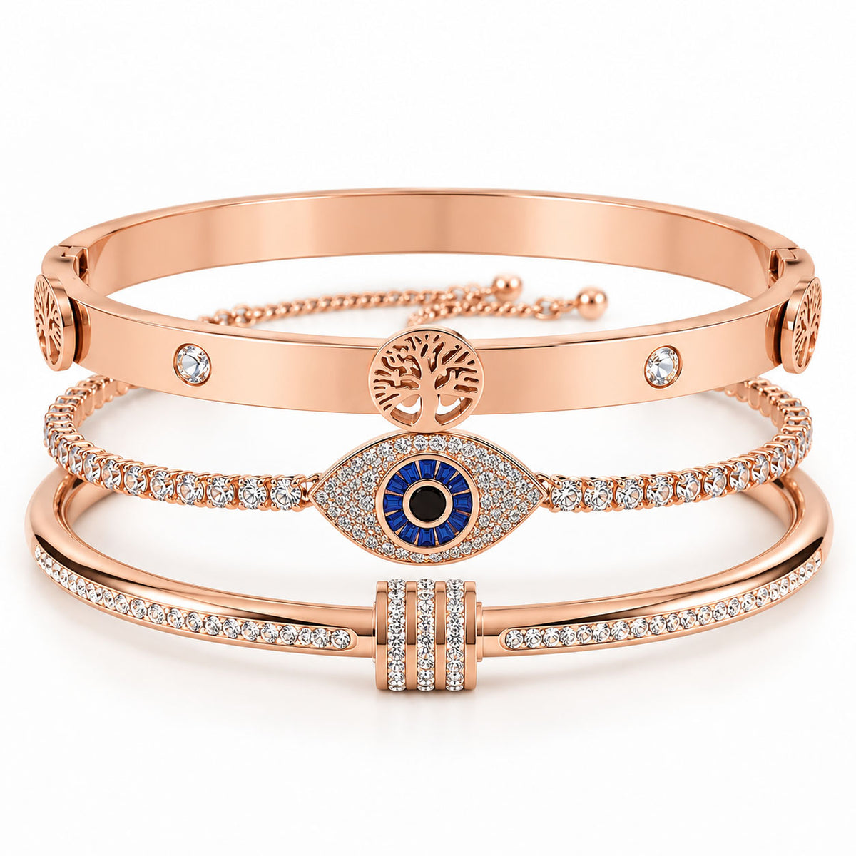 A product photo of a stacked set of rose gold bracelets featuring a hinge bangle with a Tree of Life pendant, a crystal tennis bracelet centered with a large evil eye charm, and a crystal-accented bangle with a paved barrel spacer.