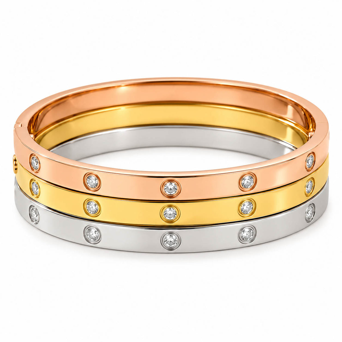 Three anti-tarnish bangles in rose gold, gold, and silver feature sparkling bezel-set crystal accents and a sleek polished finish, creating a timeless everyday stack with a premium minimalist look.