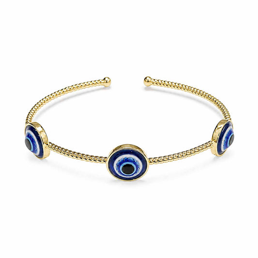 Gold open cuff bangle featuring three blue enamel evil eye charms and a textured chain-style band, displayed on a clean white background.