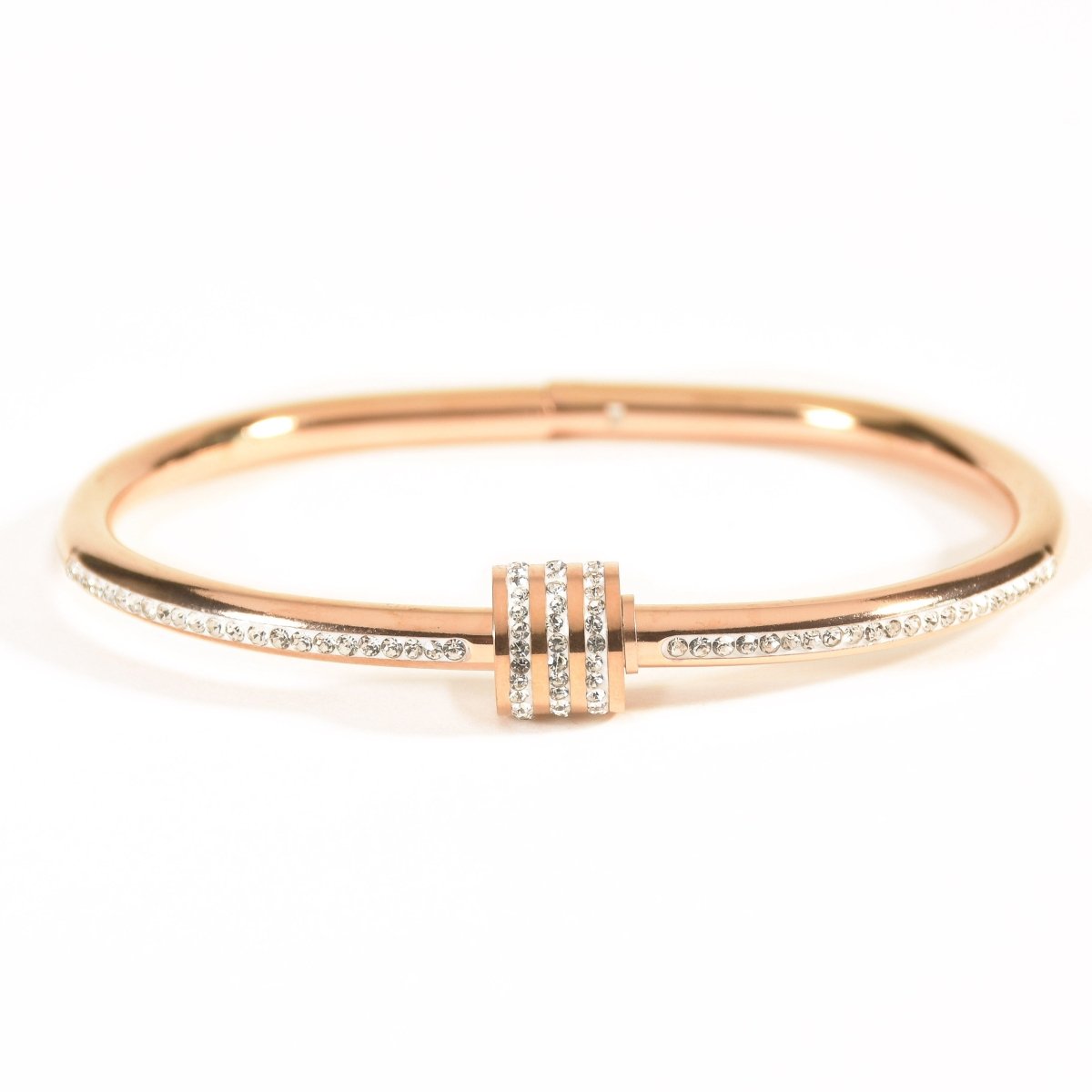 Elegant rosegold twisted sparkle bangle with shimmering stone detailing and an anti-tarnish finish, perfect for everyday glam, casual styling, gifting, and chic layered looks.

