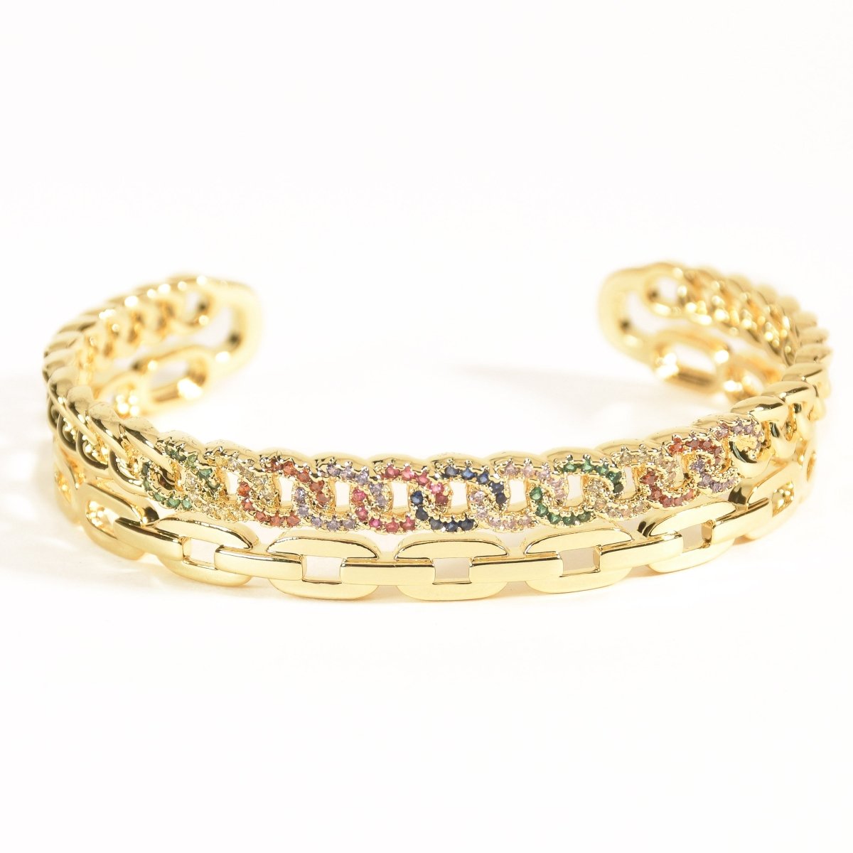 Vibrant golden rainbow cuff bangle with colorful stone detailing and an adjustable anti-tarnish finish, perfect for playful styling, stacking, and adding a bold pop of sparkle to any look.
