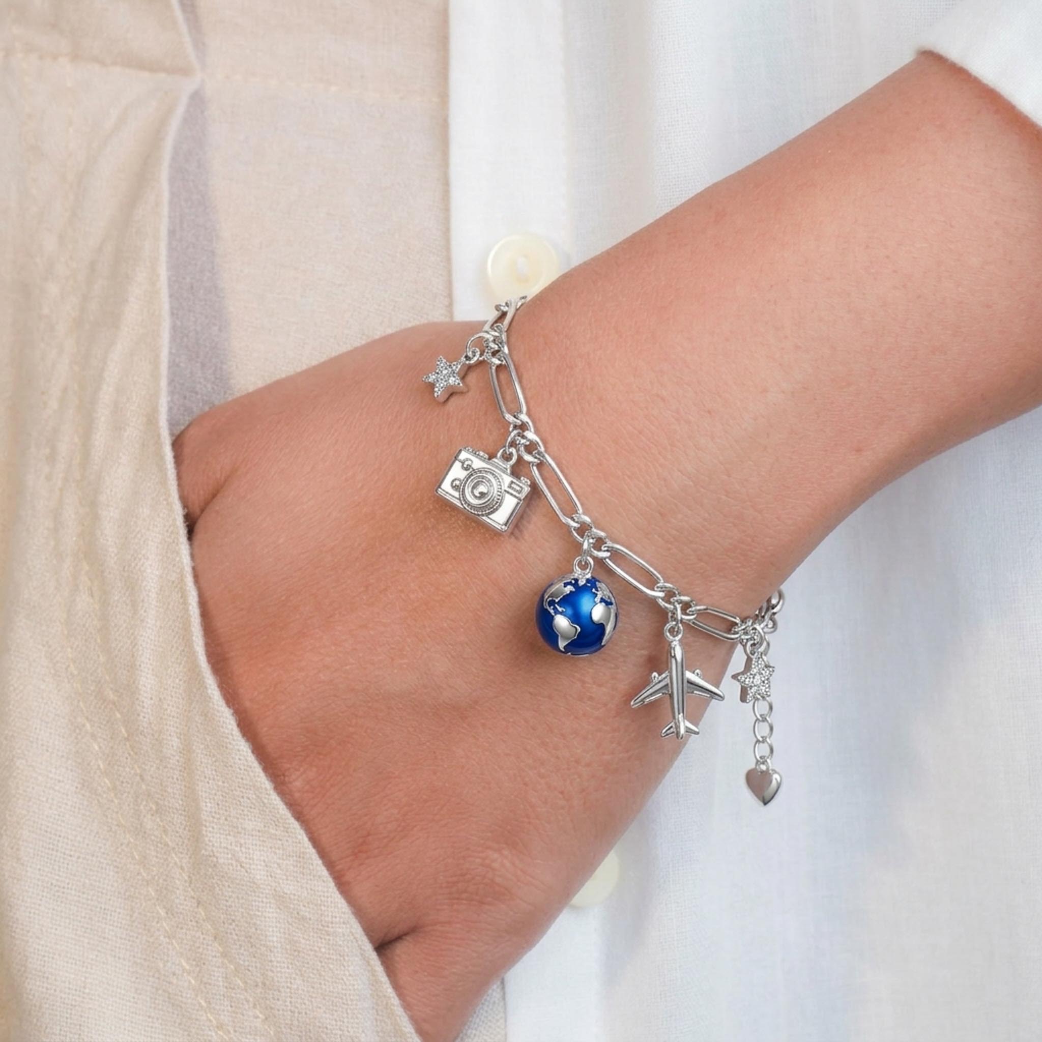 Wanderlust 925 Sterling Silver Bracelet featuring travel-inspired charms including a camera, globe, airplane, and star suspended from a polished link chain