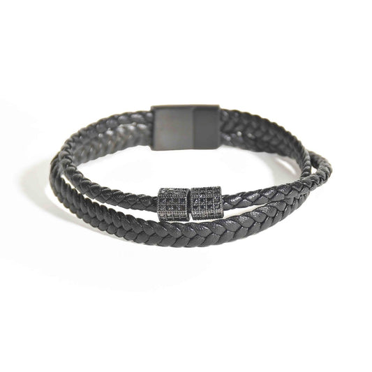 Braided leather bracelet with textured metal accents and an anti-tarnish finish, perfect for everyday wear and modern masculine styling.
